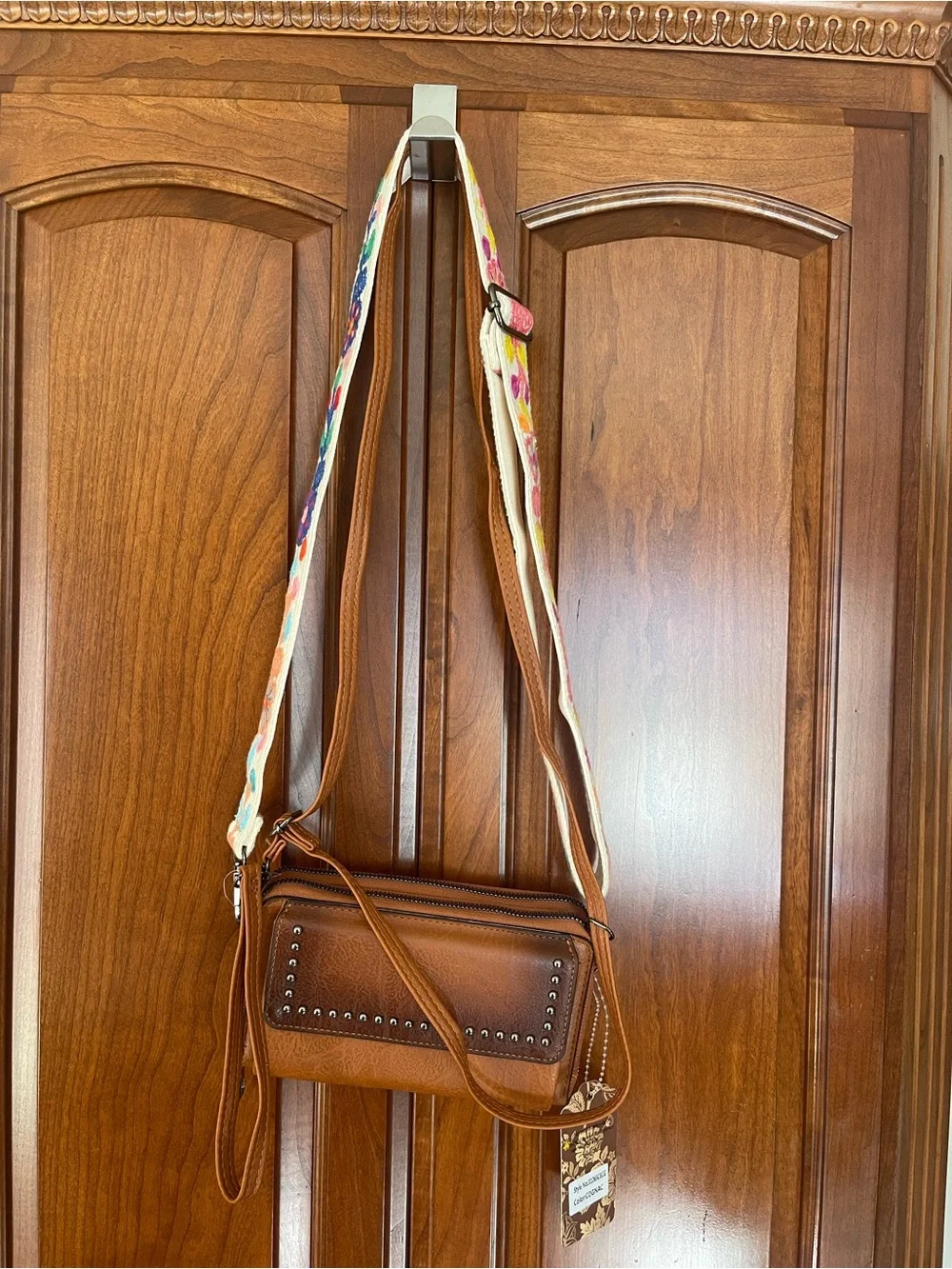 Tan Leather Crossbody Bag with Studded Front Panel and Colorful Strap